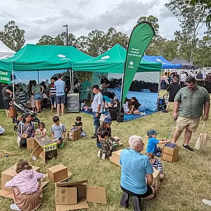 families engaging in a bush kindy pop-up event in logan